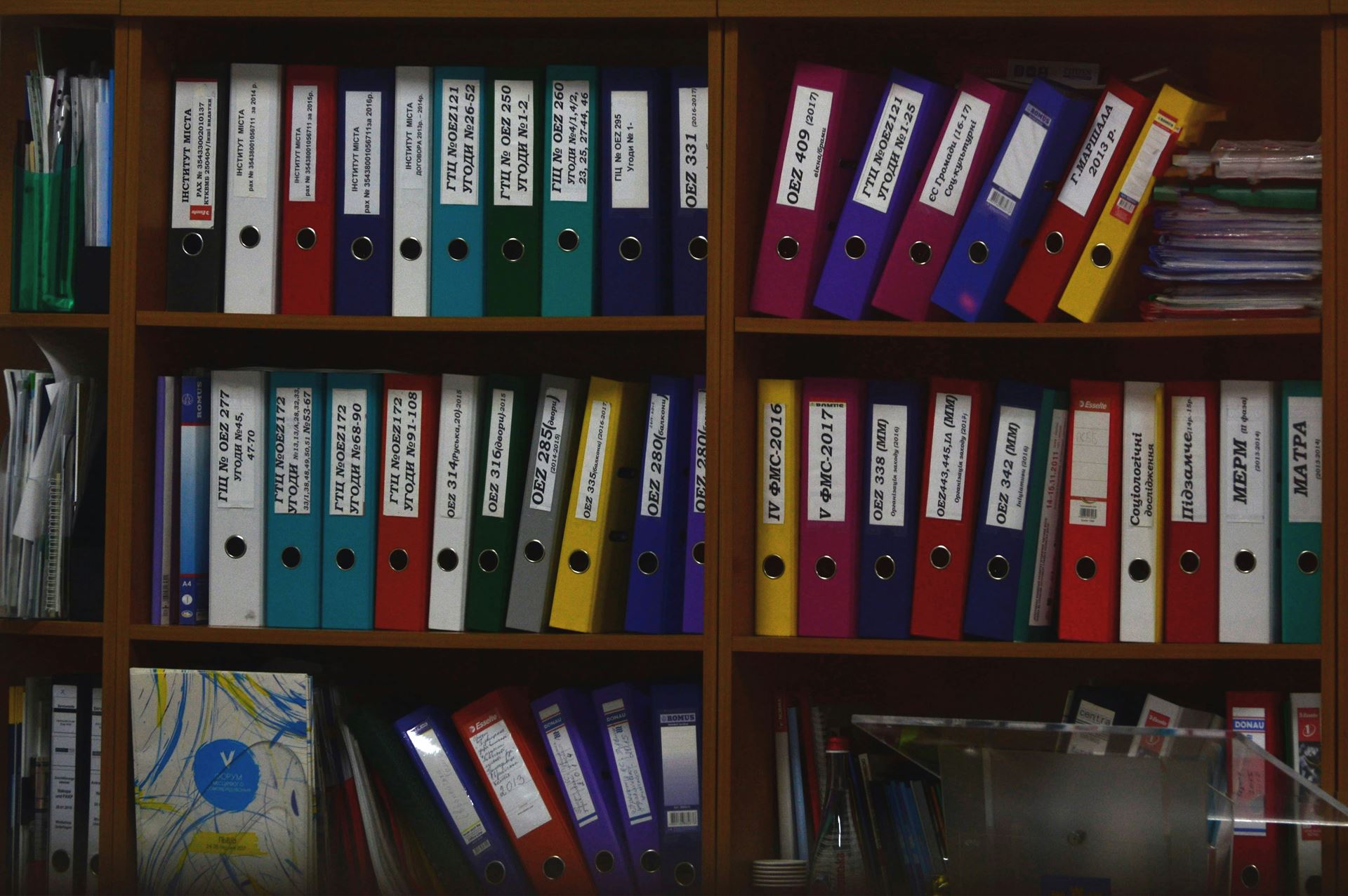 shelves of colourful folders